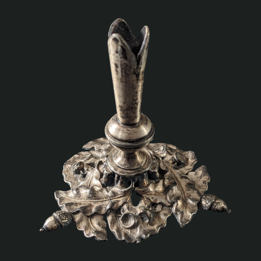 Antique Candlestick with forest themed adormnents.